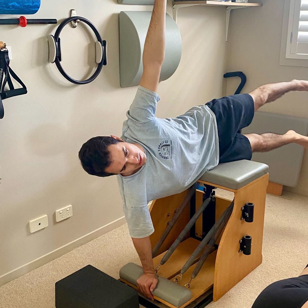Mele doing Pilates on Pilates Equipment in Kingscliff Pilates Studio